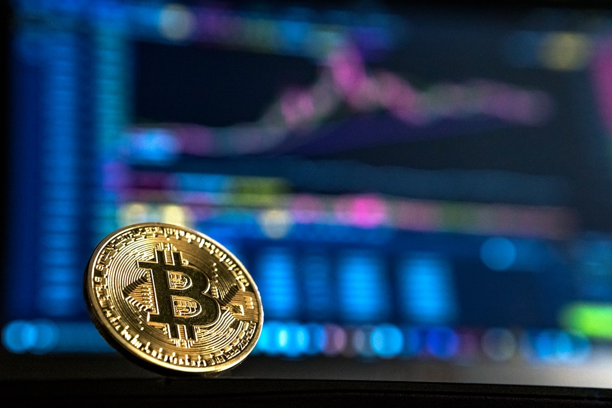 Physical crypto coins on a dark background — crypto basics